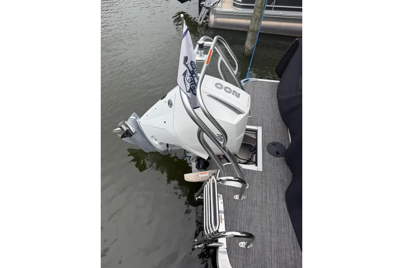 Slide: The Image of 2022 Crest Caribbean LX 230 SLS boat with outboard motor and swim ladder. - 20