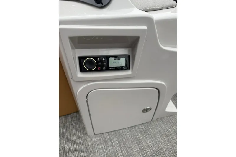 Slide: The Image of 2022 Crest Caribbean LX 230 SLS boat console with Fusion stereo system. - 28