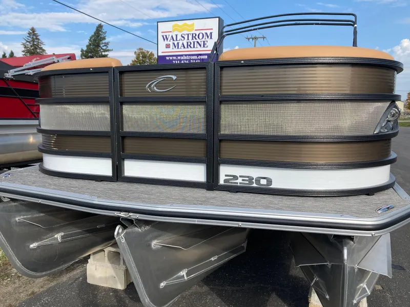 Slide: The Image of 2022 Crest Caribbean LX 230 SLS pontoon boat displayed at Walstrom Marine dealership. - 3