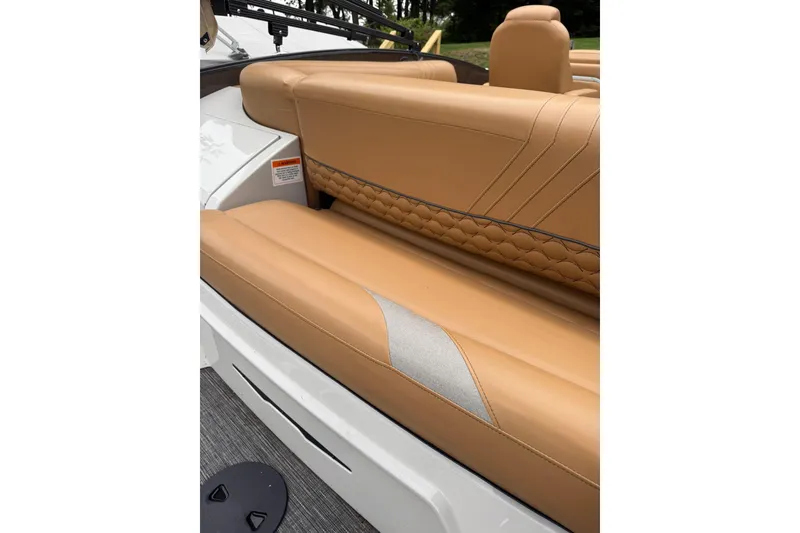 Slide: The Image of 2022 Crest Caribbean LX 230 SLS boat with tan leather seating and quilted design. - 30