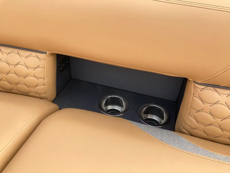 Slide: The Image of Tan leather seating with cup holders in 2022 Crest Caribbean LX 230 SLS. - 6