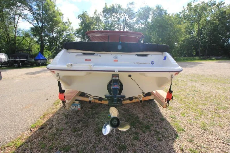 Slide: The Image of 1994 Sea Ray 180 Bow Rider boat on trailer, rear view, outdoors. - 5
