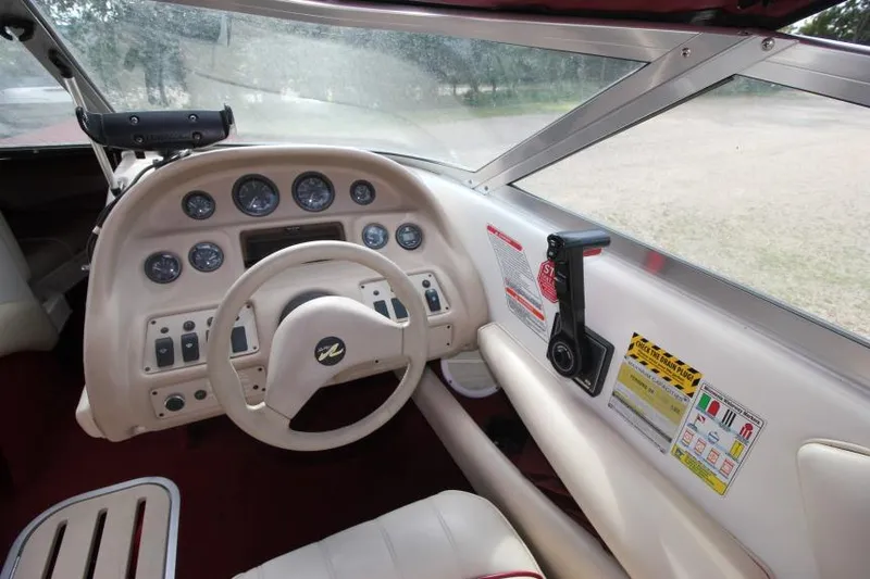 Slide: The Image of 1994 Sea Ray 180 Bow Rider dashboard with steering wheel and instrument panel. - 7