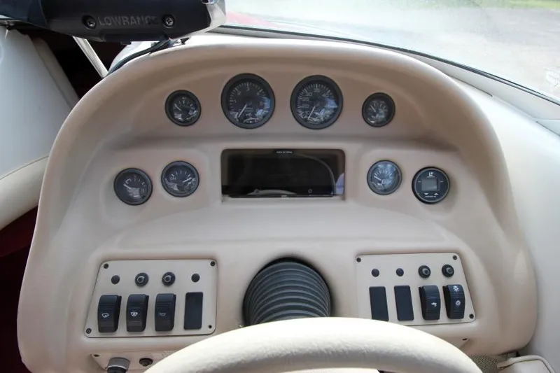Slide: The Image of Dashboard of a 1994 Sea Ray 180 Bow Rider boat with gauges and controls. - 8