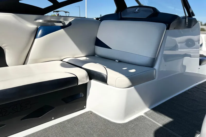 Slide: The Image of Interior seating of a 2014 Axis A24 boat, featuring sleek, modern design. - 7