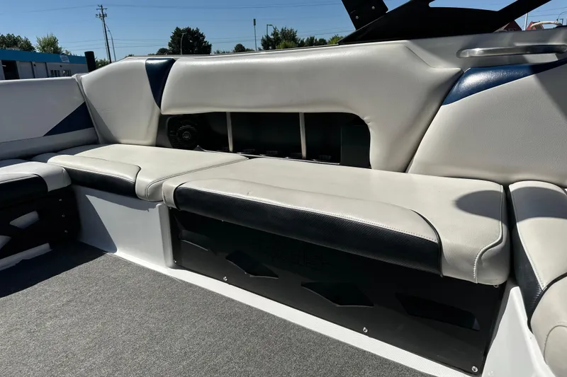 Slide: The Image of Interior seating of 2014 Axis A24 boat with white and black upholstery. - 8