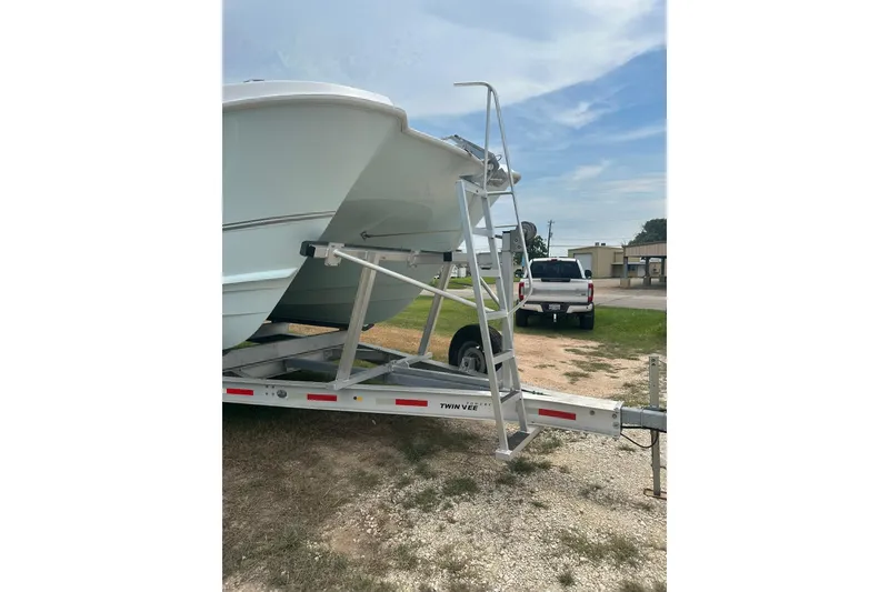 Slide: The Image of 2023 Twin Vee 340 GFX CC boat on trailer, parked outdoors. - 15