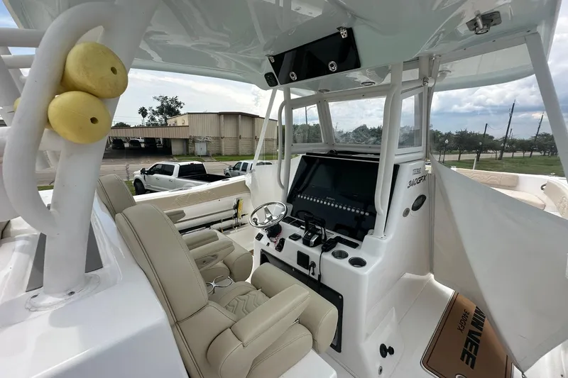 Slide: The Image of 2023 Twin Vee 340 GFX CC boat interior with modern helm and seating. - 17