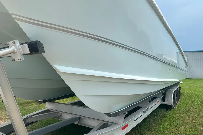 Slide: The Image of 2023 Twin Vee 340 GFX CC boat on trailer, side view. - 2