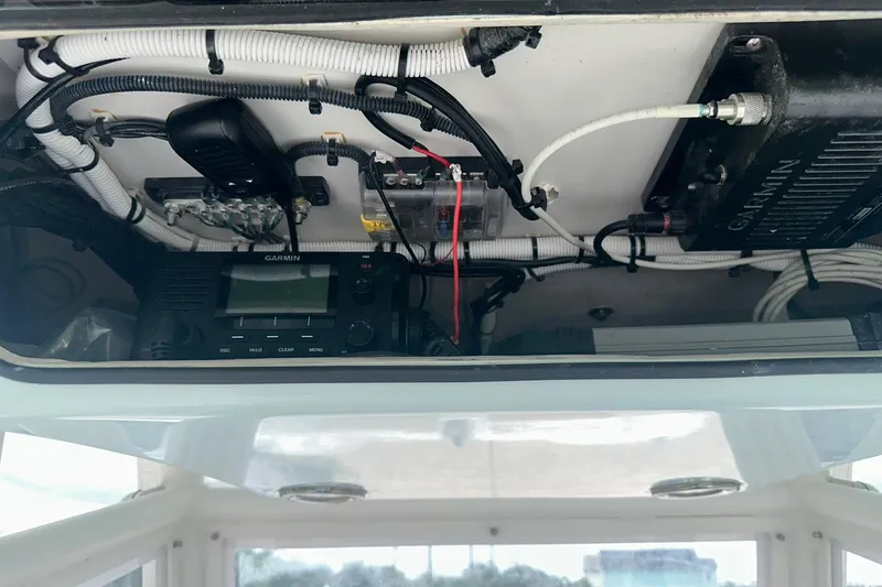 Slide: The Image of 2023 Twin Vee 340 GFX CC boat electronics, featuring Garmin equipment and wiring setup. - 21