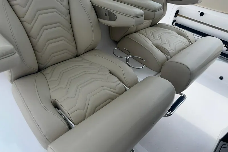 Slide: The Image of Luxurious beige seating in 2023 Twin Vee 340 GFX CC boat interior. - 26