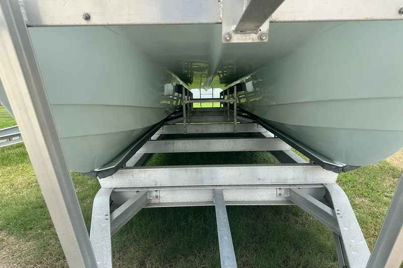 Slide: The Image of 2023 Twin Vee 340 GFX CC catamaran hull on trailer, viewed from below. - 3