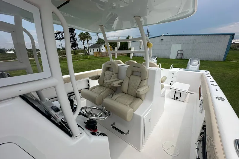 Slide: The Image of 2023 Twin Vee 340 GFX CC boat interior with luxurious seating and modern controls. - 30