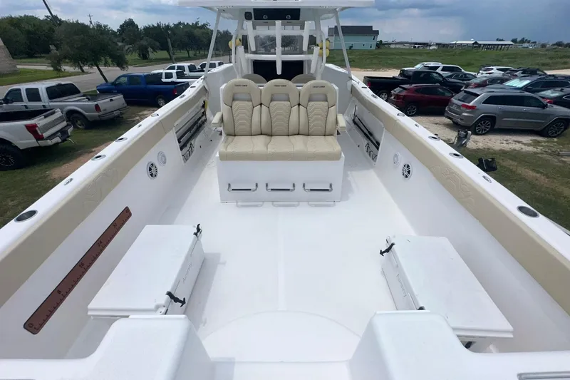 Slide: The Image of 2023 Twin Vee 340 GFX CC boat interior with beige seating and spacious deck. - 33