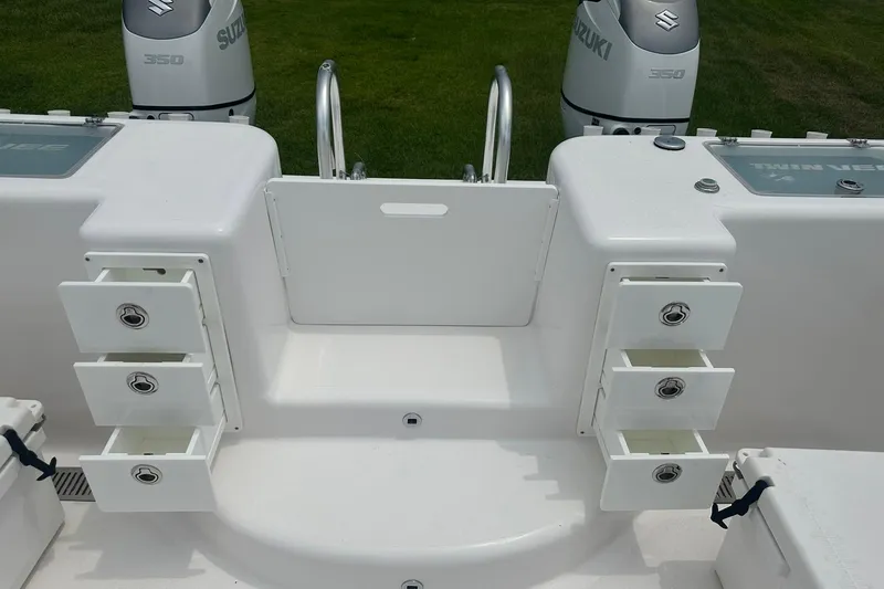 Slide: The Image of 2023 Twin Vee 340 GFX CC boat with Suzuki 350 engines and storage compartments. - 37
