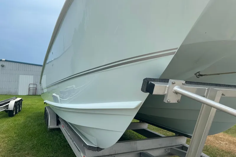 Slide: The Image of 2023 Twin Vee 340 GFX CC boat on trailer, side view, outdoors. - 4