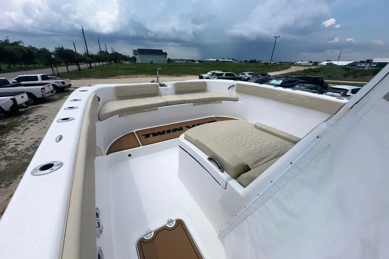 Slide: The Image of 2023 Twin Vee 340 GFX CC boat with spacious seating and sleek design. - 52
