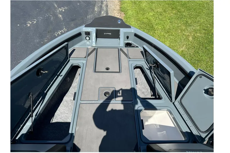 Slide: The Image of 2026 Lund 185 Impact GL boat interior with open storage compartments. - 23