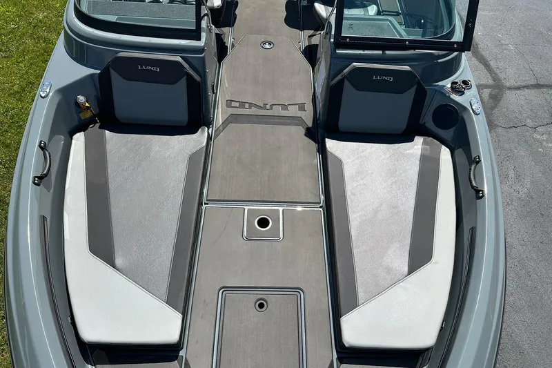 Slide: The Image of 2026 Lund 185 Impact GL boat interior with gray seating and deck. - 24