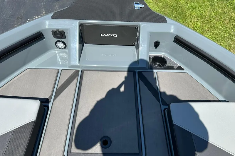 Slide: The Image of 2026 Lund 185 Impact GL boat interior with seating and storage compartments. - 28