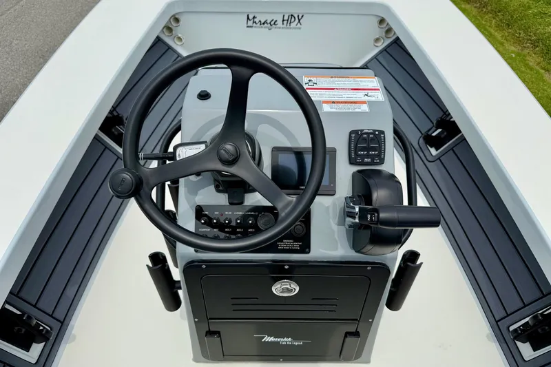 Slide: The Image of 2026 Maverick 17 HPX-S boat console with steering wheel and controls. - 10