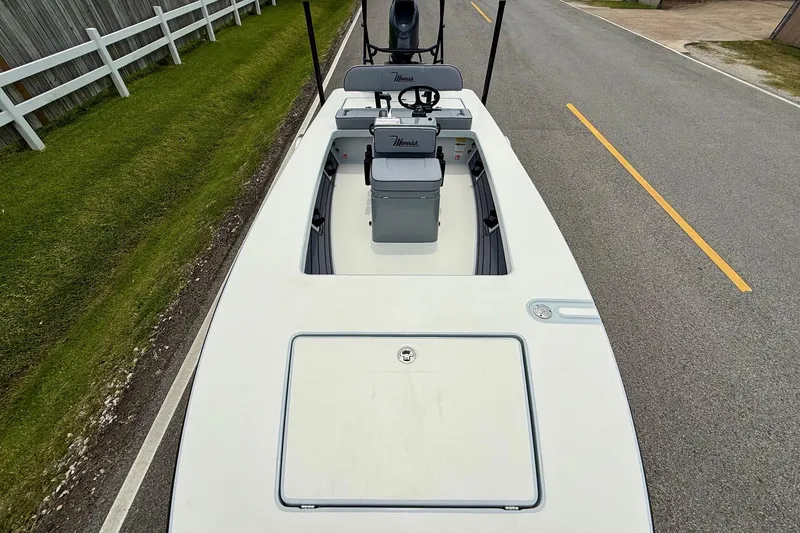 Slide: The Image of 2026 Maverick 17 HPX-S boat on road, top view, near white fence. - 14