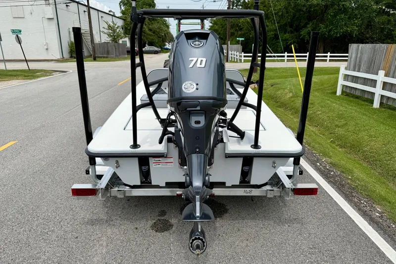 Slide: The Image of 2026 Maverick 17 HPX-S boat on trailer, rear view with 70 HP engine. - 3