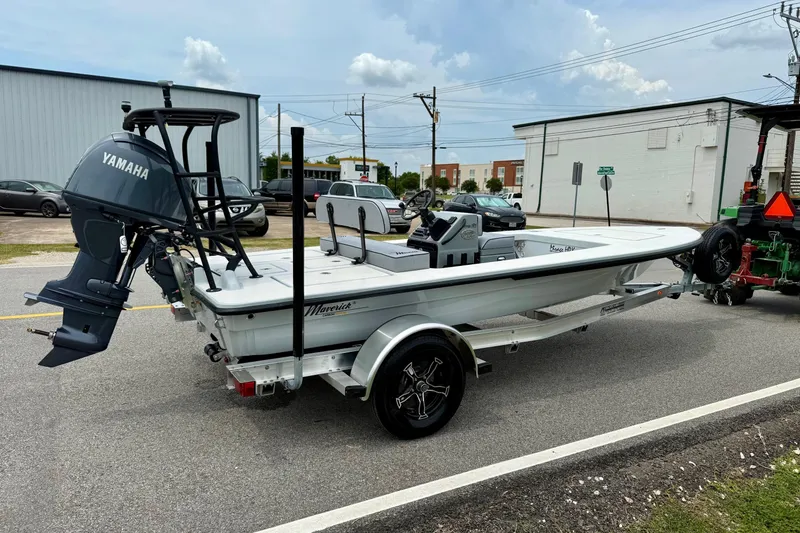 Slide: The Image of 2026 Maverick 17 HPX-S boat on trailer with Yamaha outboard motor, parked on street. - 4