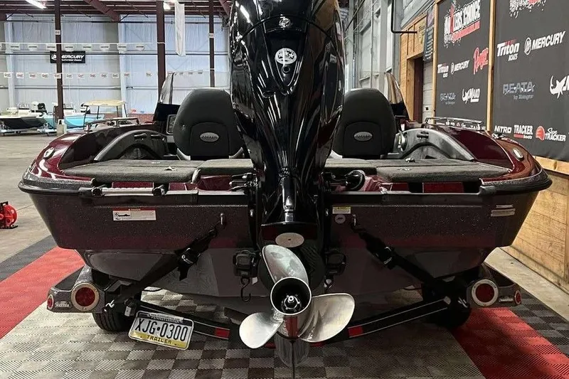 Slide: The Image of 2015 Ranger 1880 Angler boat in showroom, rear view with motor and propeller. - 5