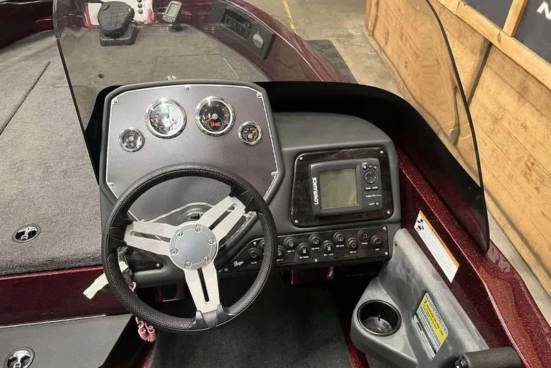 Slide: The Image of 2015 Ranger 1880 Angler boat dashboard with steering wheel and navigation system. - 6