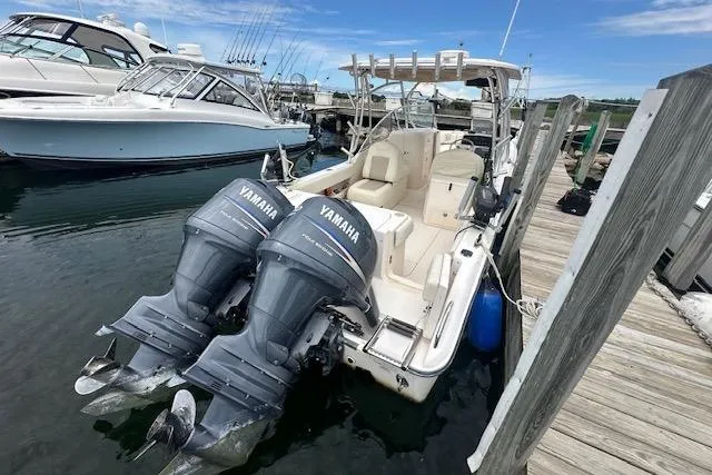 Slide: The Image of 2010 Grady-White Tournament 275 boat with spacious bow seating at dock. - 2