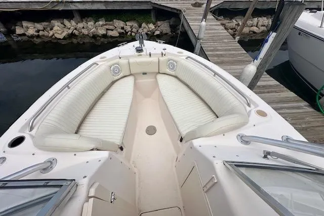 Slide: The Image of 2010 Grady-White Tournament 275 boat docked in a scenic marina under a cloudy sky. - 4