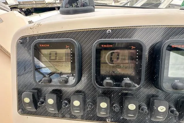 Slide: The Image of 2010 Grady-White Tournament 275 boat docked in a marina. - 6