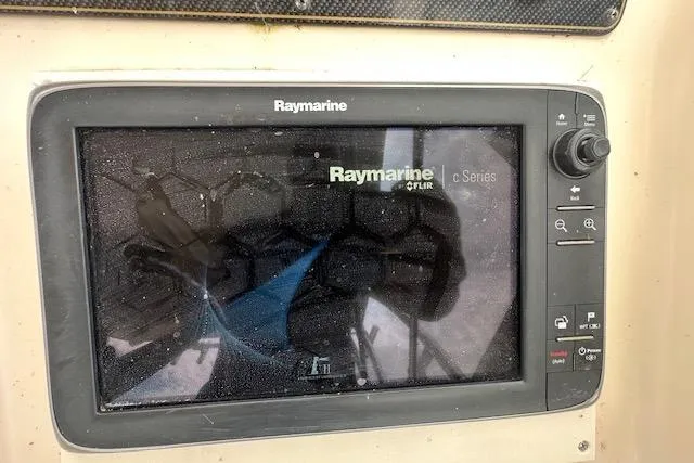 Slide: The Image of 2010 Grady-White Tournament 275 dashboard with tachometers and switches. - 7