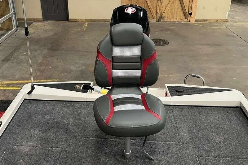 Slide: The Image of 2026 Ranger RT198P boat seat with red and gray design in a showroom setting. - 3