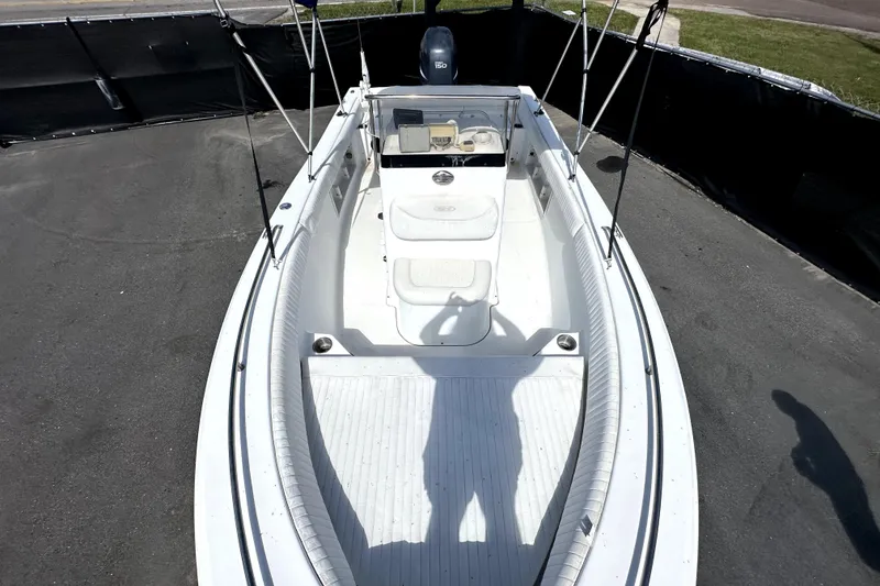 Slide: The Image of 2008 Sea Hunt Ultra 196 boat, white interior, parked on pavement, overhead view. - 26