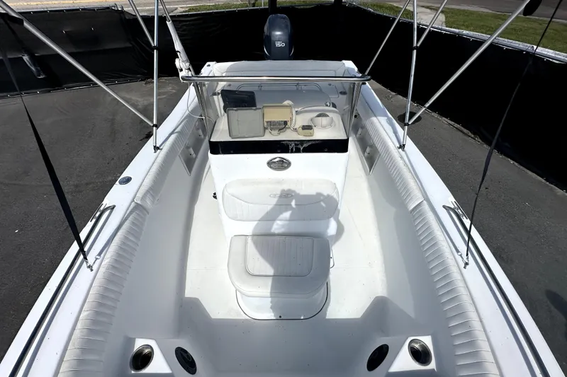 Slide: The Image of 2008 Sea Hunt Ultra 196 boat interior with seating and console, viewed from above. - 28