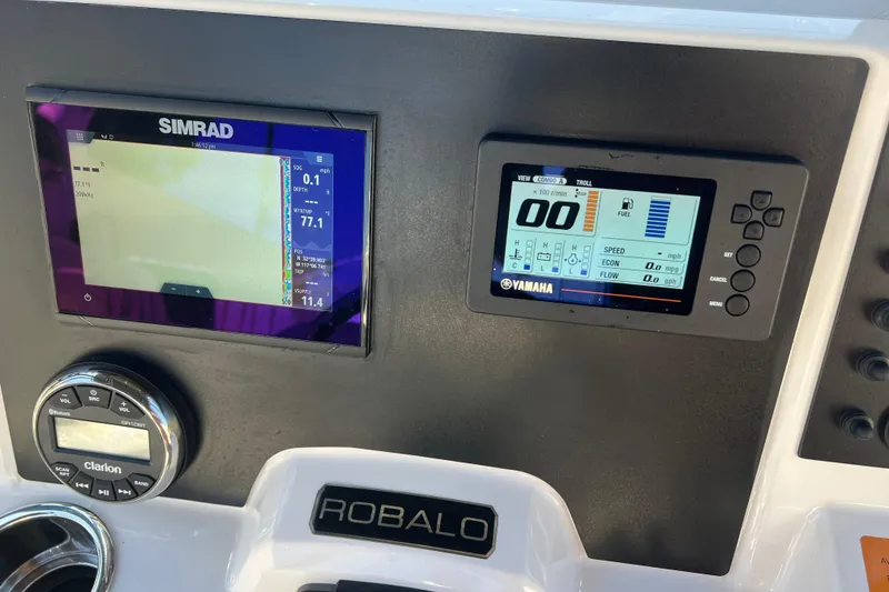 Slide: The Image of 2023 Robalo R200 Center Console dashboard with Simrad and Yamaha displays. - 10