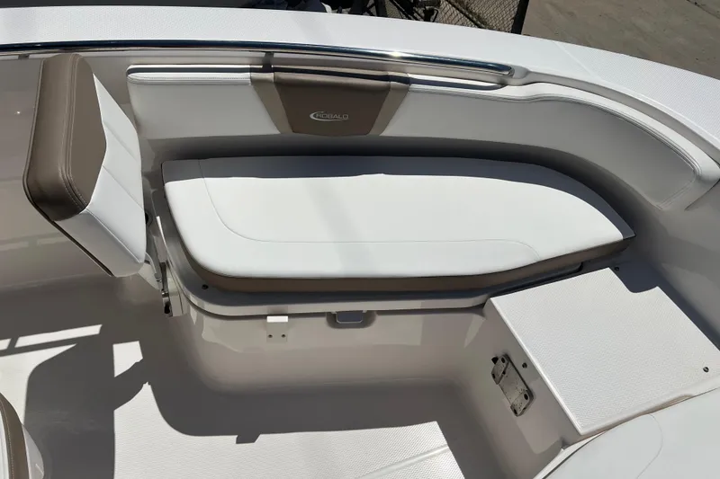 Slide: The Image of 2023 Robalo R200 Center Console boat interior with cushioned seating and storage. - 18