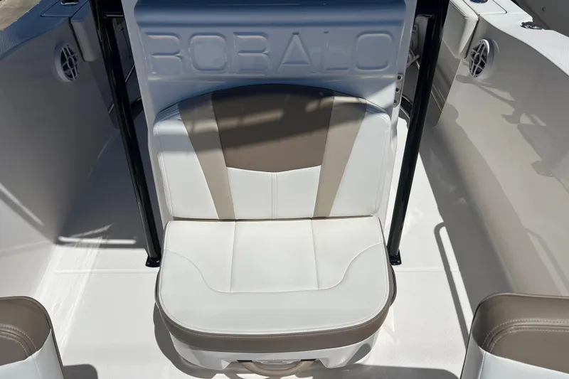 Slide: The Image of 2023 Robalo R200 Center Console boat seat with embossed logo, white and beige upholstery. - 20