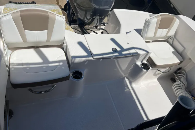 Slide: The Image of 2023 Robalo R200 Center Console boat interior with seating and motor view. - 22