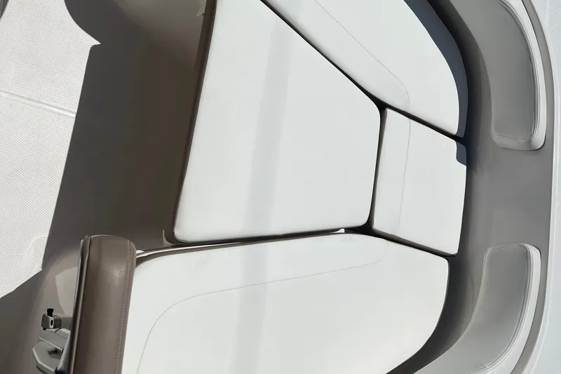 Slide: The Image of 2023 Robalo R200 Center Console boat interior with cushioned seating. - 25