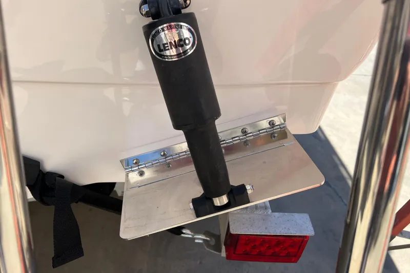 Slide: The Image of 2023 Robalo R200 Center Console boat with Lenco trim tab detail. - 32