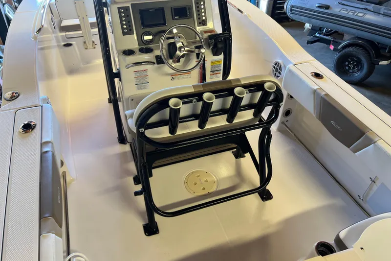 Slide: The Image of 2023 Robalo R200 Center Console boat interior with steering wheel and control panel. - 37