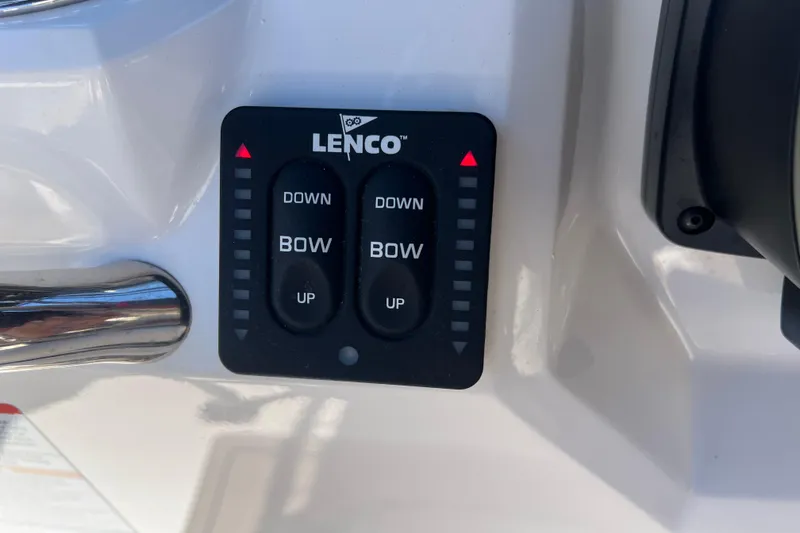 Slide: The Image of Lenco trim tab control panel on 2023 Robalo R200 Center Console boat. - 42
