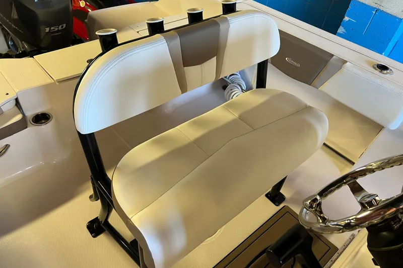 Slide: The Image of 2023 Robalo R200 Center Console boat interior with seating and steering wheel. - 6