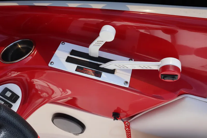 Slide: The Image of Red and white control panel of 2007 Caravelle Interceptor 232SS Bow Rider boat. - 11