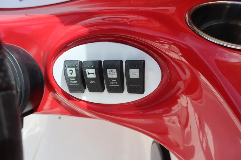 Slide: The Image of Control panel of 2007 Caravelle Interceptor 232SS Bow Rider with switches for navigation and accessories. - 12