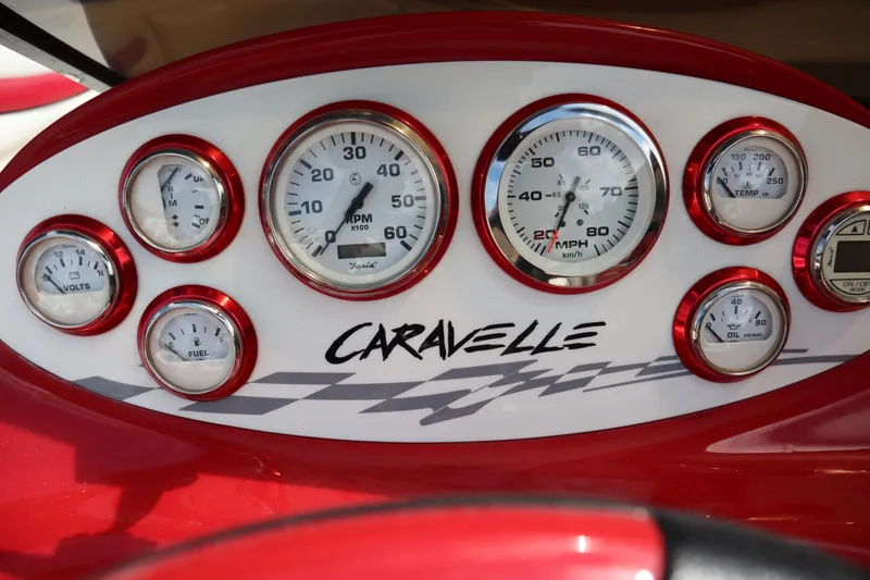 Slide: The Image of Dashboard of 2007 Caravelle Interceptor 232SS Bow Rider with gauges and logo. - 13