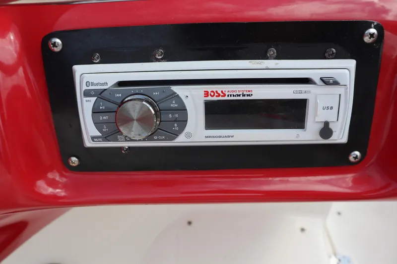 Slide: The Image of Boss Marine audio system in 2007 Caravelle Interceptor 232SS Bow Rider, featuring Bluetooth and USB. - 16